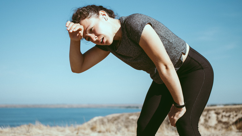 woman having a hard time running