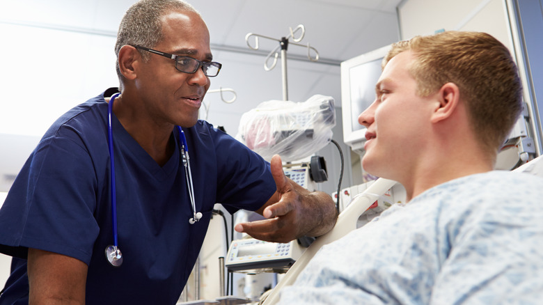 doctor interviewing patient in emergency room