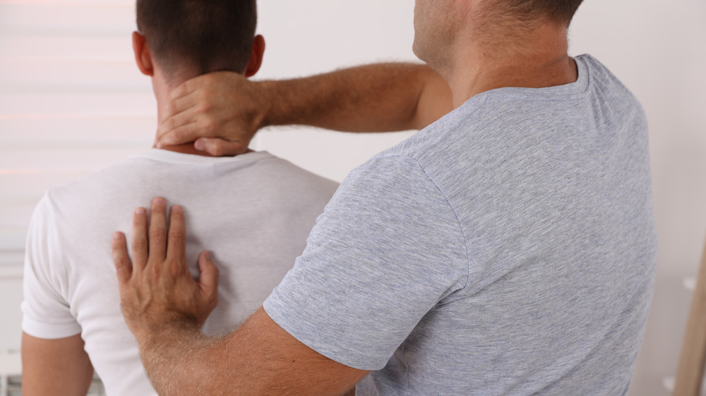 Male patient receiving chiropractic treatment