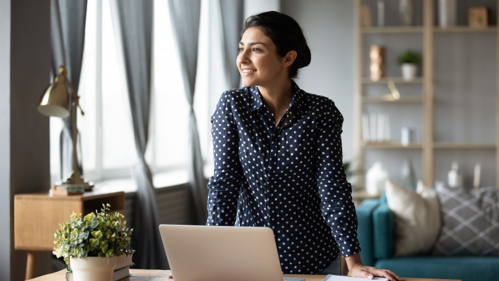 woman standing up while working