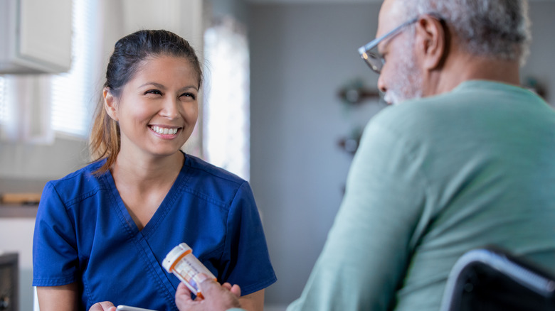 Man looking at medicine bottle