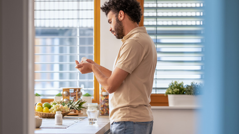 man taking some medication