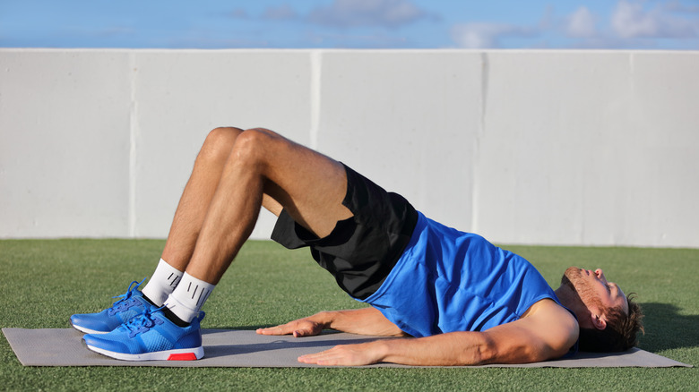 man doing glute bridge