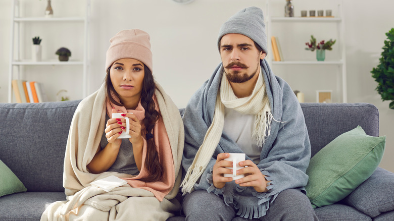 young couple sick with a cold