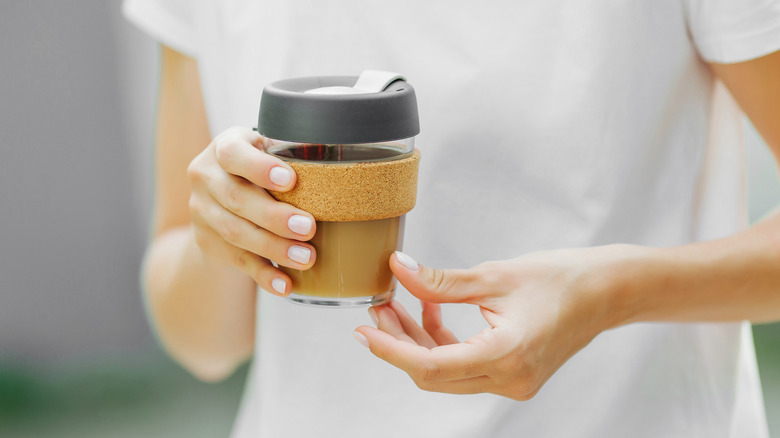 woman holding a cup of coffee