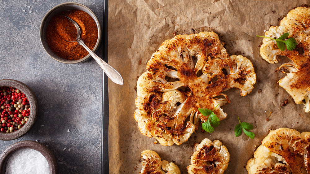 Cauliflower cut into steaks and grilled with seasonings