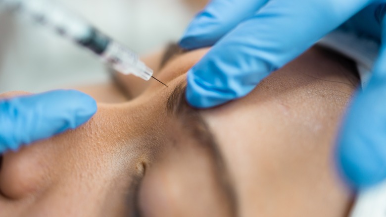 Woman getting Botox injection