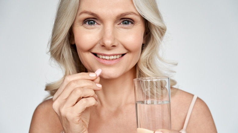 woman taking buspirone medication 