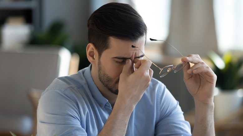 man feeling fatigue