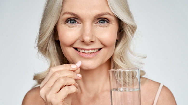 woman taking Humira medication