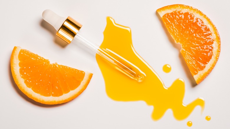 Orange slices and vitamin C serum