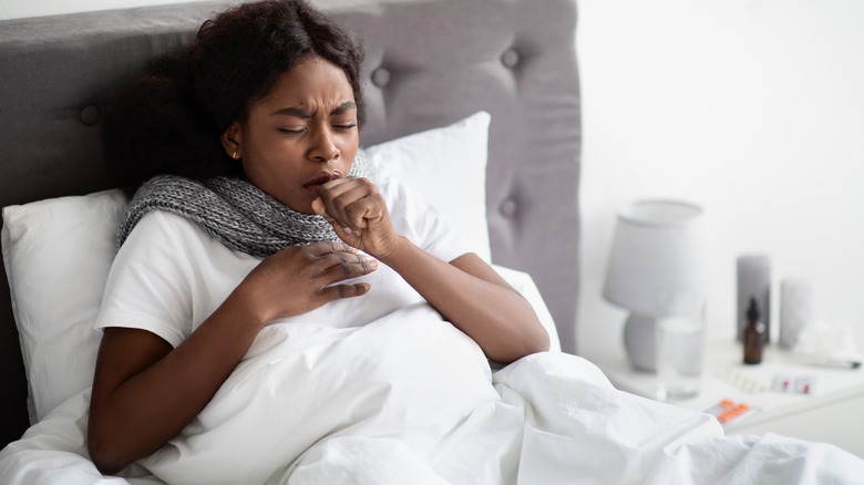 woman sick in bed