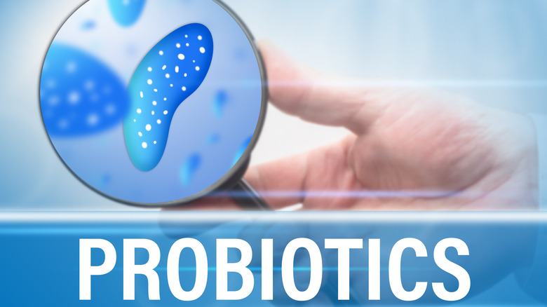 'Probiotics' label with microbe under magnifying glass