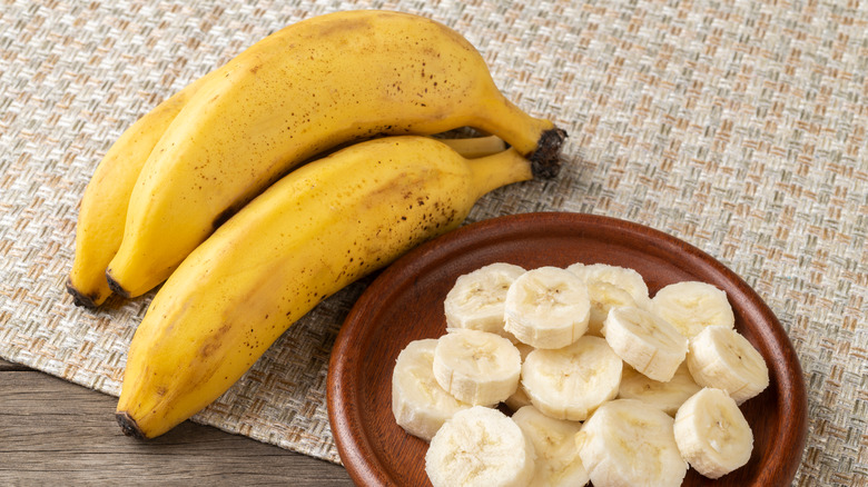 banana with slice on plate