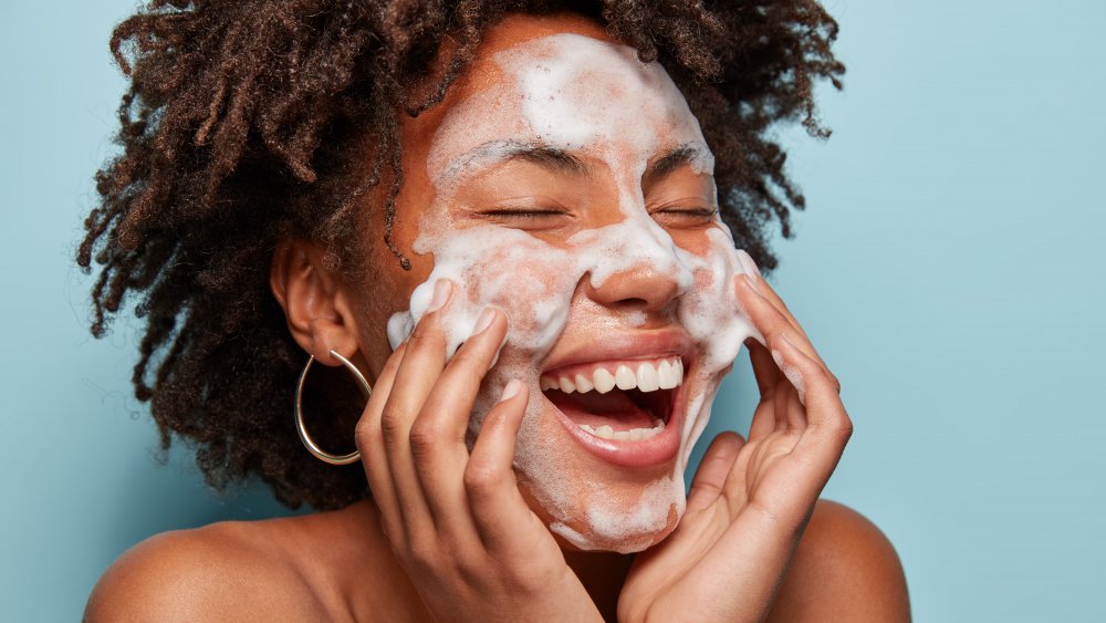 Woman washing face