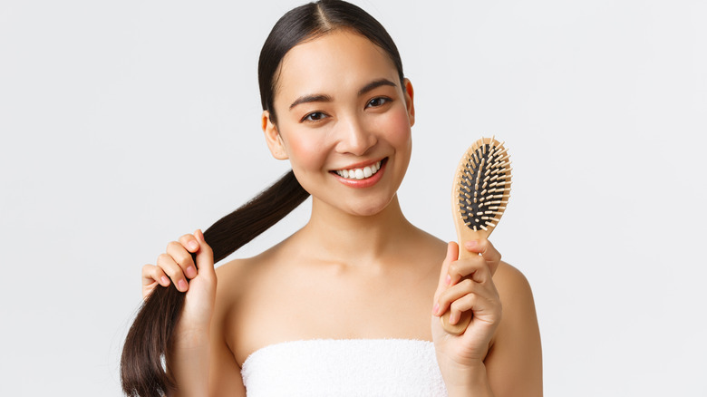 Woman holding a hair brush