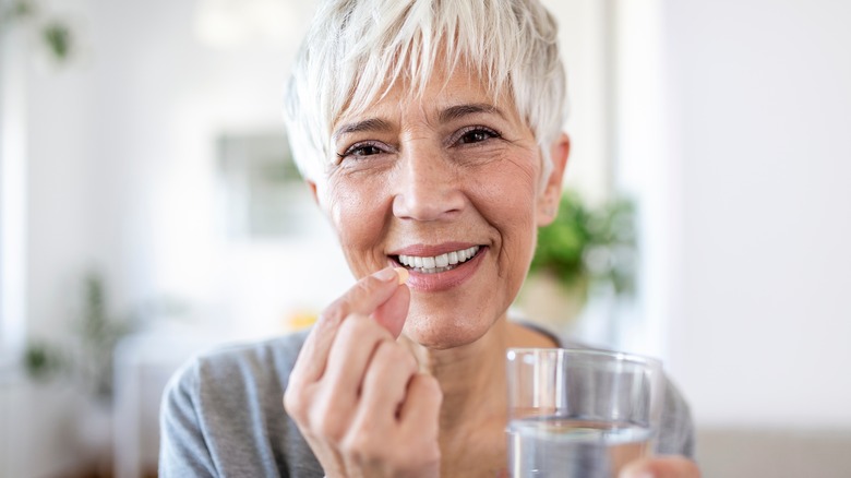 woman taking medication