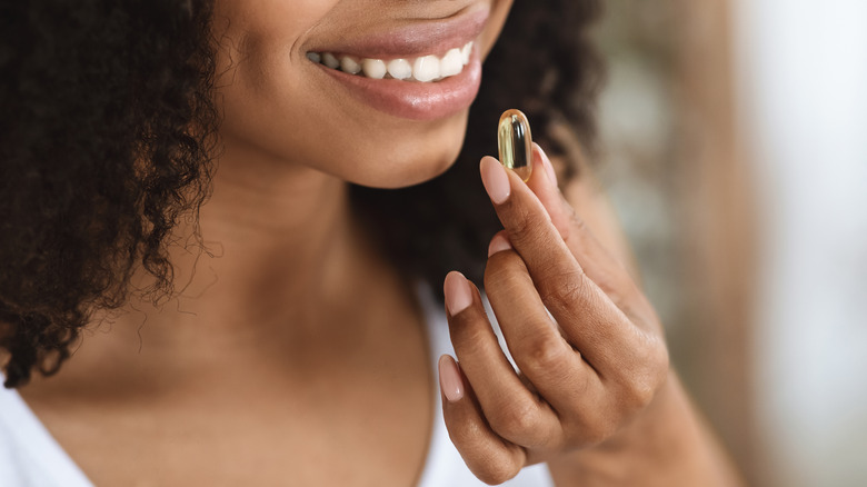 woman taking vitamin