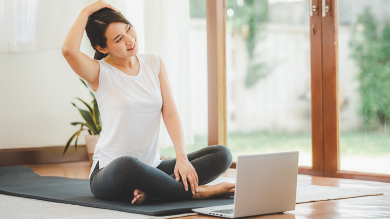 woman doing neck stretches
