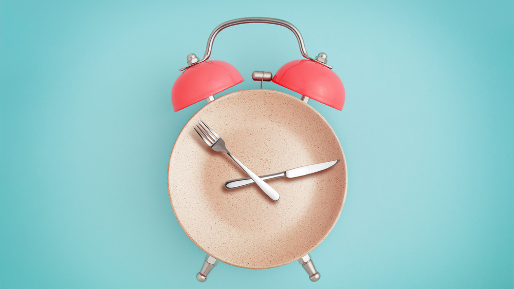 Alarm clock with cutlery and plate