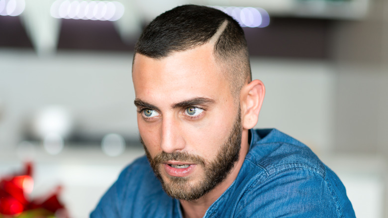 Talking young man with green eyes