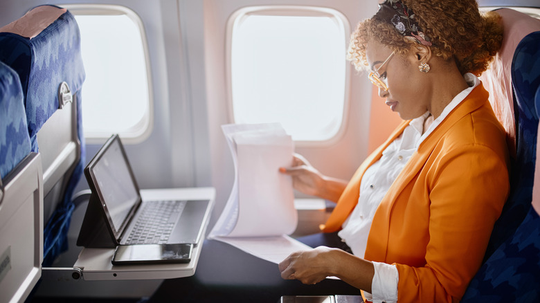 Woman sitting inside plane