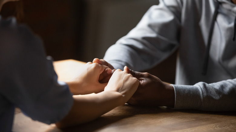 Close up of a couple holding hands