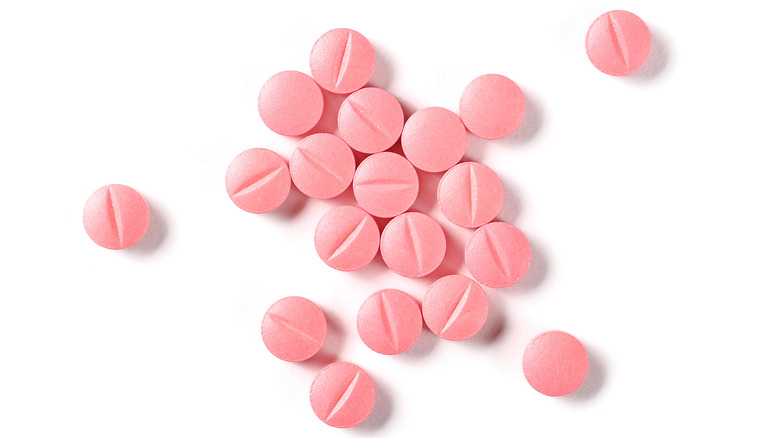 A close up of little pink pills