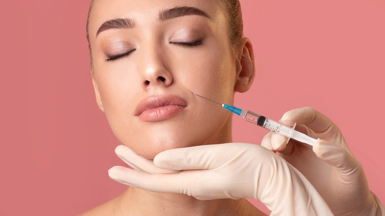 Woman getting lip fillers