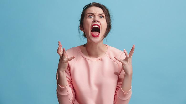A woman screaming in anger