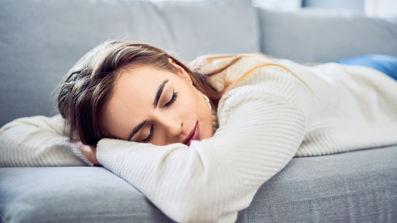 Woman napping on couch