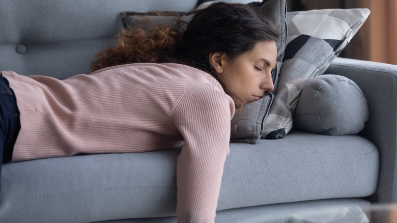 Woman napping on couch