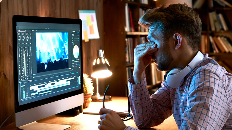 Man at computer with eye strain