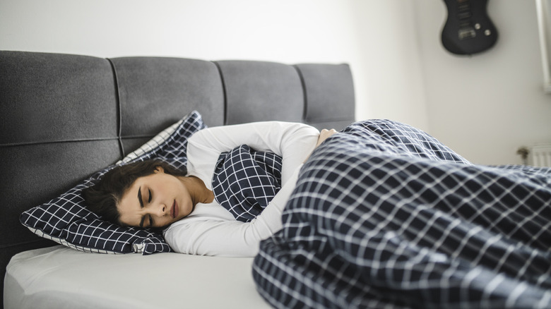 Woman sleeping on side