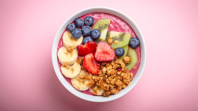 Acai bowl on pink background