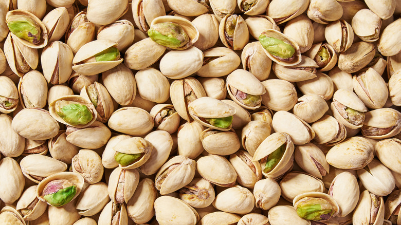 A large pile of pistachios