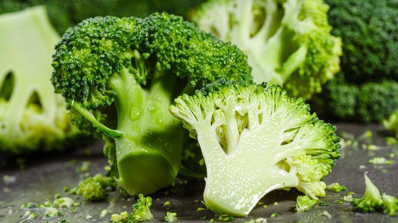 Raw broccoli florets on a table