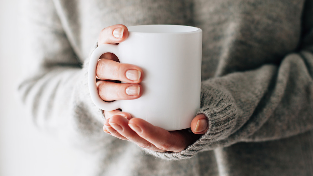 woman holding mug