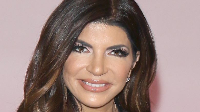 Close up of Teresa Giudice with light pink background 