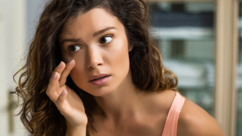 Woman with eye bags and puffy eyes