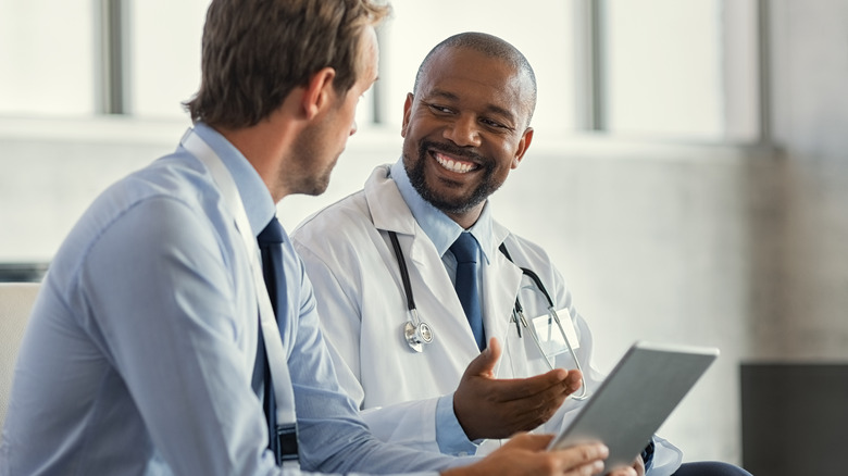doctor talking to male patient