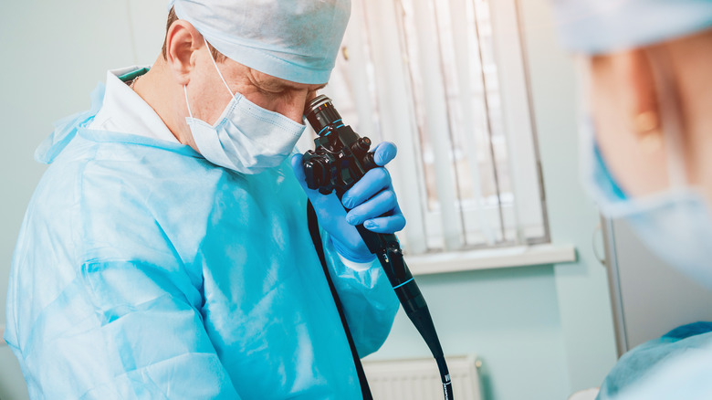 doctor looking through the endoscope