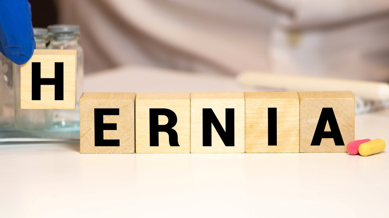 letter blocks spelling out "hernia"
