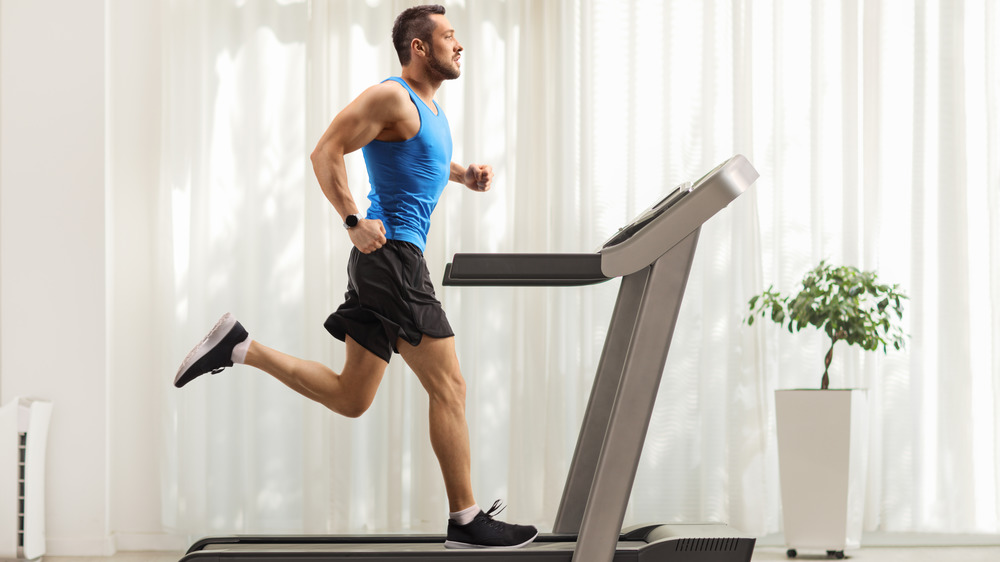 man running on treadmill