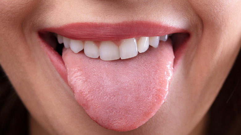 Close-up of person sticking tongue out of their mouth