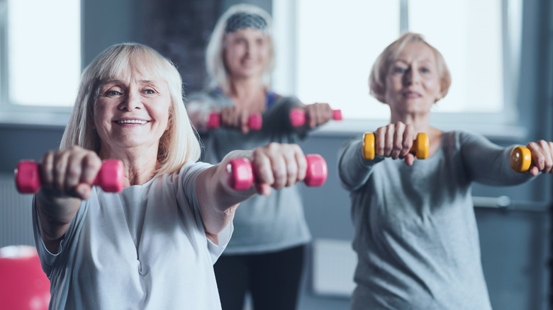 mature women lifting weights