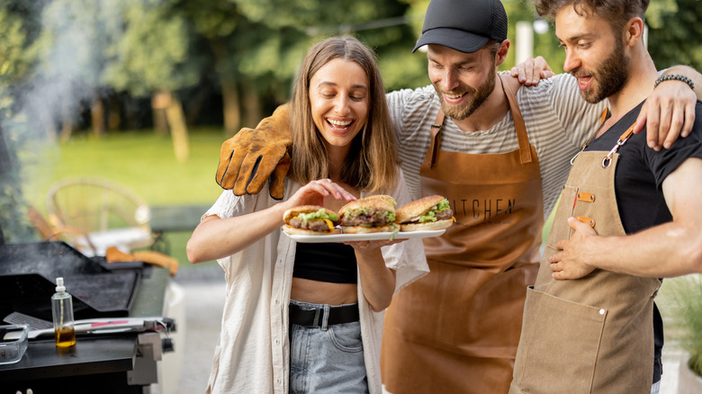 Young people enjoying burgers