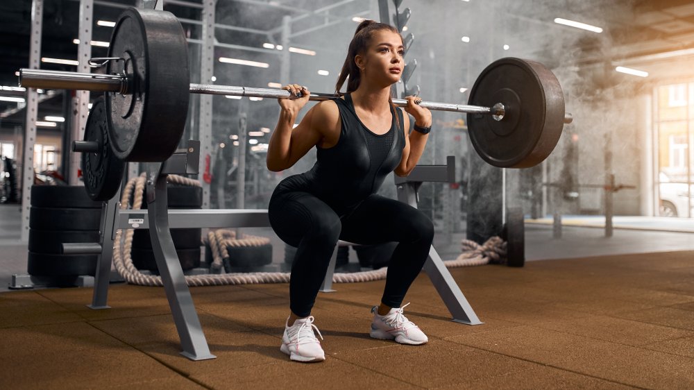 Woman doing back squat