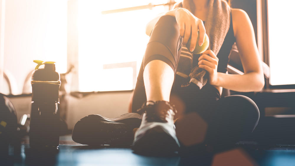 woman sitting in gym