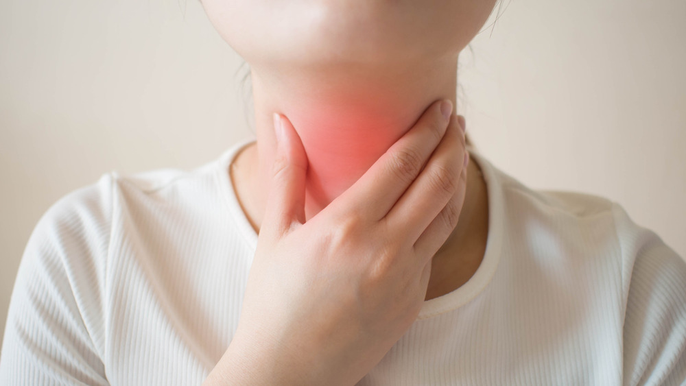 Close up of neck with throat highlighted in red